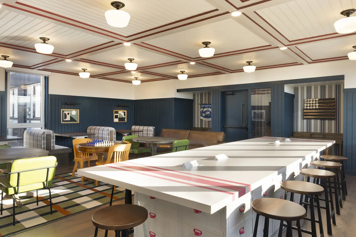 Study area with tables and seating and cozy lighting.
